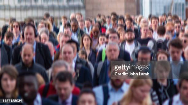 motion-blurred image of commuters making their way to work - commuter benefits stock pictures, royalty-free photos & images