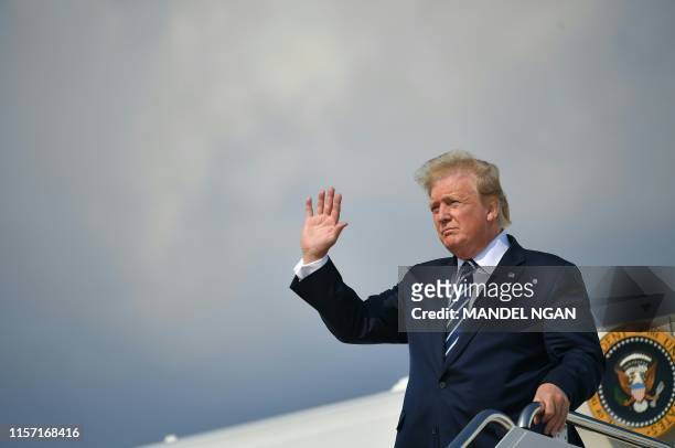 President Donald Trump steps off Air Force One upon arrival at Andrews Air Force Base in Maryland on July 21, 2019. - Trump is returning to...