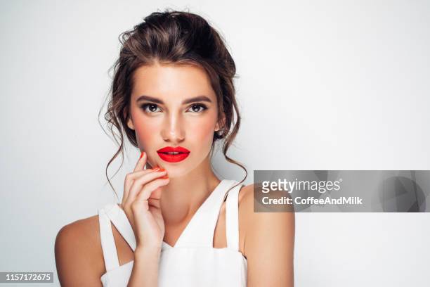 beautiful woman with make-up - red lips stock pictures, royalty-free photos & images