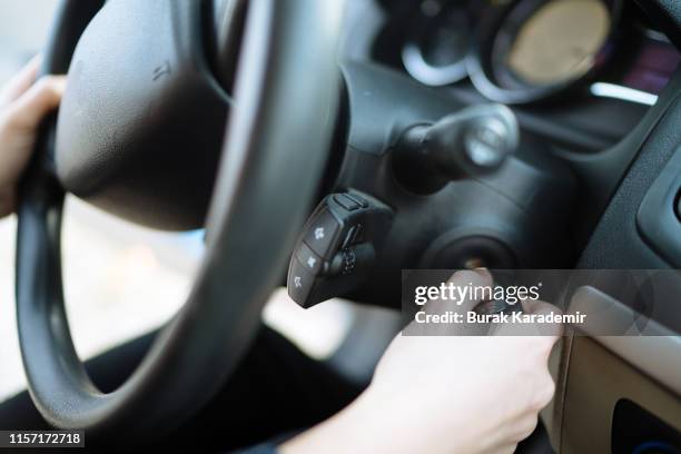 woman starting car - zündschloß stock-fotos und bilder