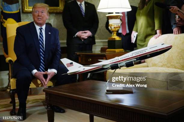 Model of the proposed paint scheme of the next generation of Air Force One is on display during a meeting between U.S. President Donald Trump and...