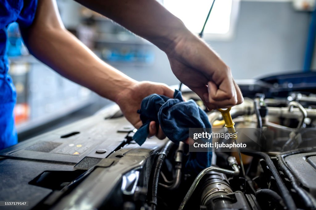 Checking oil in car engine