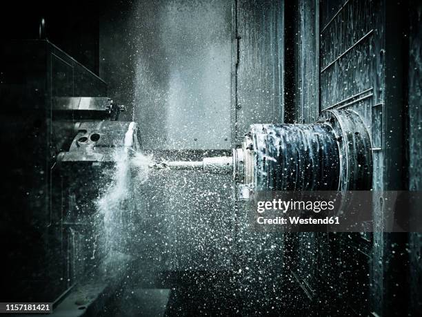 cnc machine drilling with coolant - cnc stock pictures, royalty-free photos & images