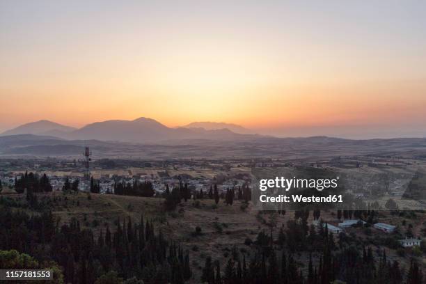 greece, thebes, plain and town at sunset - テーベ ストックフォトと画像