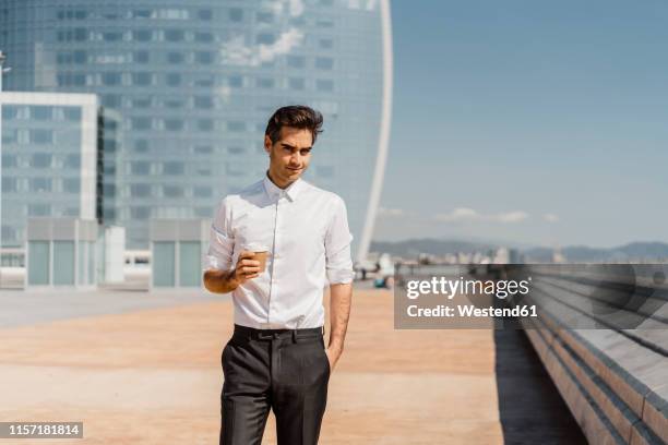 portrait of businessman with takeaway coffee in the city - promenade seafront stock pictures, royalty-free photos & images