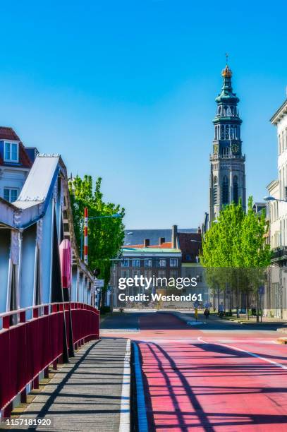 zeeland, middelburg, bridge and church tower of nieuwe kerk - middelburg netherlands stock-fotos und bilder