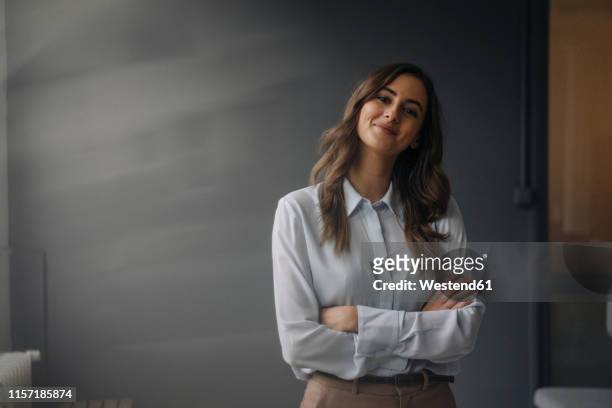 portrait of confident young businesswoman - grey blouse stock pictures, royalty-free photos & images