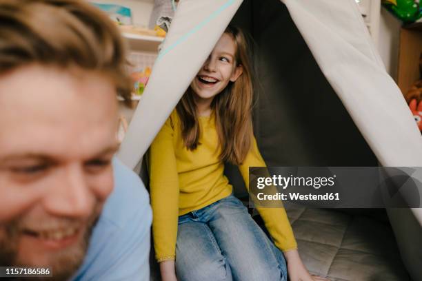 happy father and daughter with teepee in children's room - father and daughter play stock-fotos und bilder