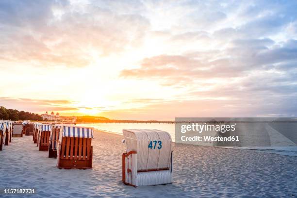 germany, mecklenburg-western pomerania, ruegen, binz, beach at sunset - strandkorb stock-fotos und bilder