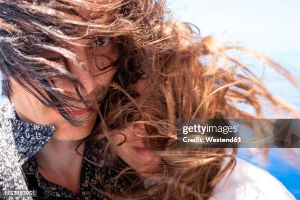 seychelles, indian ocean, mature couple with windswept hair, close-up - hair love - fotografias e filmes do acervo