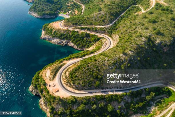 greece, aerial view of coastal road at igoumenitsa - epirus greece stock pictures, royalty-free photos & images