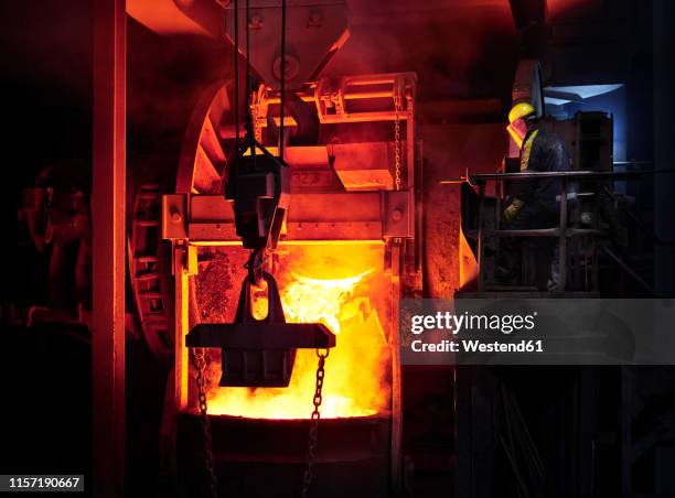 industry, worker controlling smelting process - blast furnace stock pictures, royalty-free photos & images