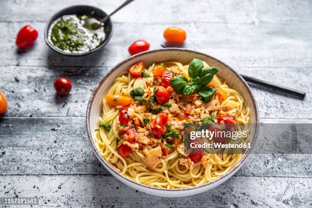 spaghetti with tomato salmon sauce and ramson pesto - lachs stock-fotos und bilder