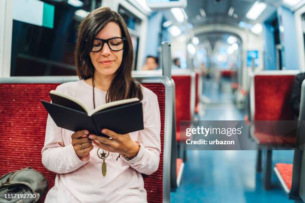 killing loneliness with a great book - metro hamburg stock pictures, royalty-free photos & images