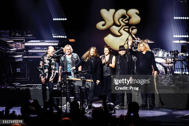 Steve Howe, Geoffrey Downes, Jon Davison, Jay Schellen, Alan White and Billy Sherwood of English progressive rock group Yes performing live on stage...