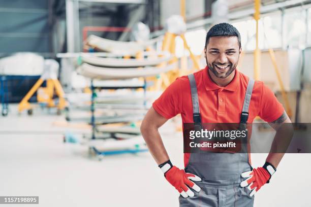 ground crew member in the hangar - mechanic uniform stock pictures, royalty-free photos & images