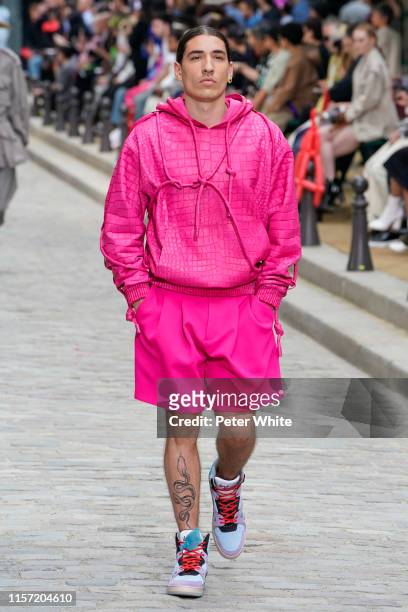 Héctor Bellerín walks the runway during the Louis Vuitton Menswear Spring Summer 2020 show as part of Paris Fashion Week on June 20, 2019 in Paris,...