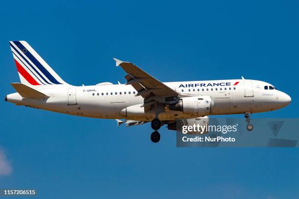Air France Airbus A319 aircraft with registration F-GRHL landing during a summer blue sky day with clouds at Athens International Airport AIA...
