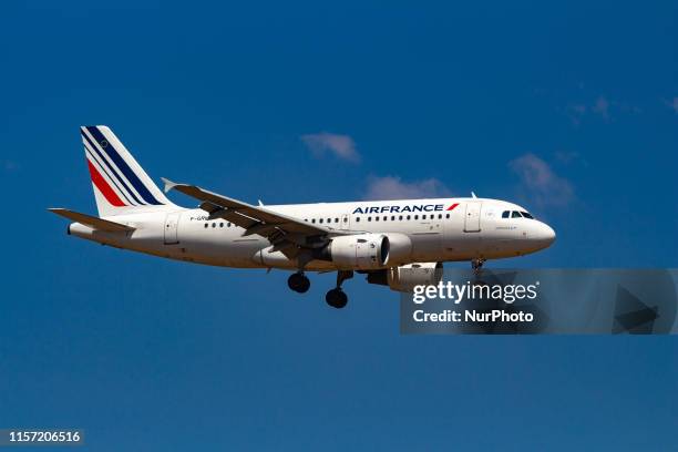 Air France Airbus A319 aircraft with registration F-GRHL landing during a summer blue sky day with clouds at Athens International Airport AIA...