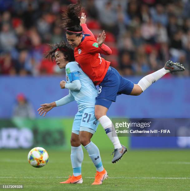 Kanjana Sung-Ngoen of Thailand competes for a header with Camila Saez of Chile during the 2019 FIFA Women's World Cup France group F match between...