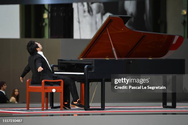 Lang Lang performs during the Karl Lagerfeld Homage at Grand Palais on June 20, 2019 in Paris, France.