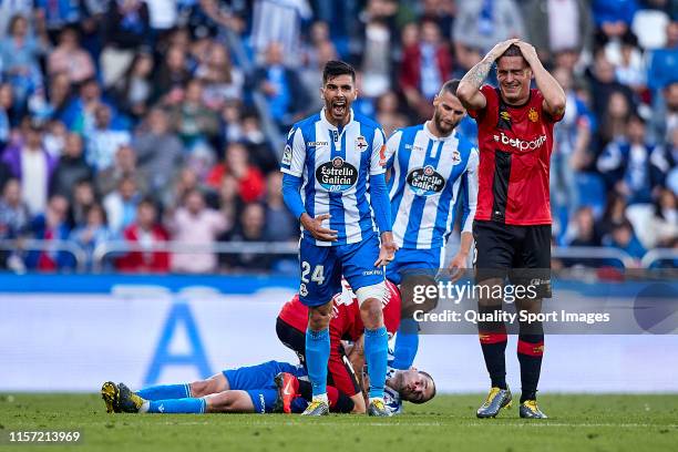 Alex Bergantinos of Deportivo de La Coruna lies injured during the La Liga 123 play off match between Deportivo De La Coruna and RCD Mallorca at...