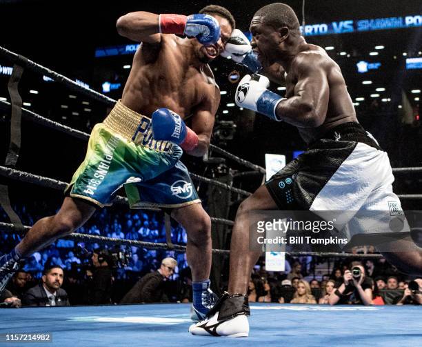 April 22: Andre Berto connects with a right punch to Shawn Porter's face in his loss by TKO in the 9th round of their WBC welterweight title...