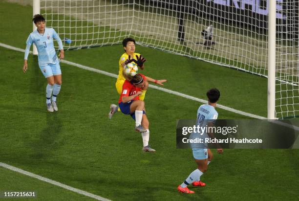Yanara Aedo of Chile collides with Waraporn Boonsing of Thailand during the 2019 FIFA Women's World Cup France group F match between Thailand and...