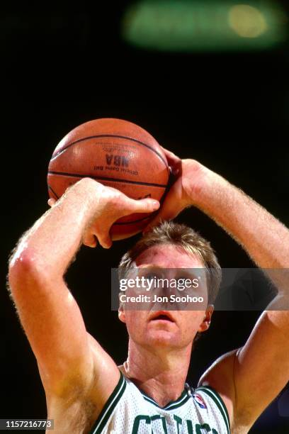 Larry Bird of the Boston Celtics shoots a free throw circa 1991 at the Boston Garden in Boston, Massachusetts. NOTE TO USER: User expressly...