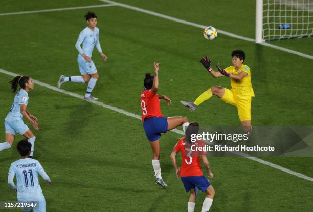 Waraporn Boonsing of Thailand fouls Maria Urrutia of Chile, which leads to Chile being awarded a penalty following a VAR review during the 2019 FIFA...