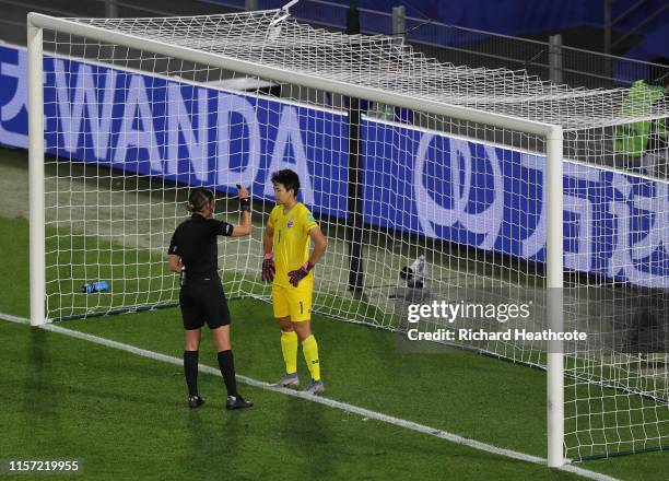 Referee Anna-Marie Keighley speaks with Waraporn Boonsing of Thailand before a penalty is taken against her during the 2019 FIFA Women's World Cup...