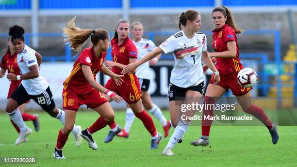 Melissa Kossler of Germany breaks free from Berta Pujadas and Laia Aleixandri of Spain challenge for the ball during the UEFA Women's Under19...