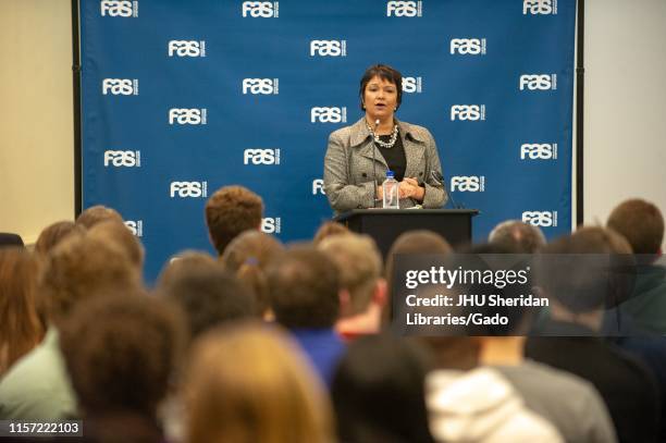 Wide shot of Lisa Jackson, chemical engineer and administrator, speaking from a podium during a Foreign Affairs Symposium at the Johns Hopkins...