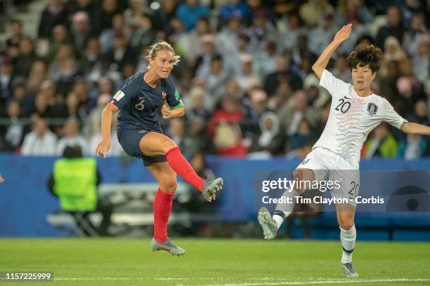 June 07. Amandine Henry of France shoots past Kim Hye-ri of South Korea to score her sides fourth goal during the France V South Korea, Group A match...