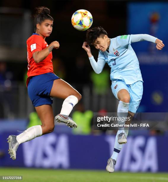 Natthakarn Chinwong of Thailand and Maria Urrutia of Chile jump for the ball during the 2019 FIFA Women's World Cup France group F match between...