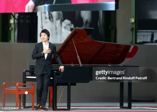 Pianist Lang Lang performs during "Karl for Ever" Tribute to Karl Lagerfeld at Grand Palais on June 20, 2019 in Paris, France.