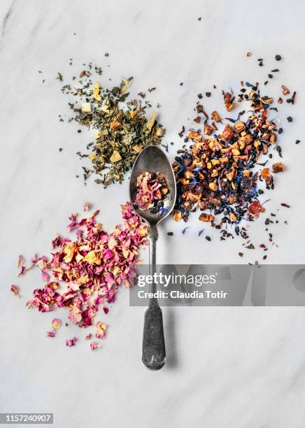 various tea leaves on white background - dried tea leaves ストックフォトと画像