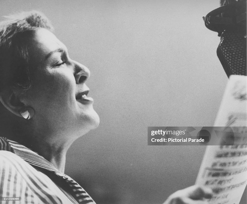 Lee Wiley , US jazz singer, holding a sheet of music while singing... News  Photo - Getty Images