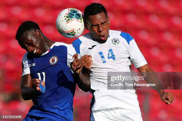 Kevin Serapio of Nicaragua heads the ball against Derrick Etienne of Haiti in the first half of the Nicaragua v Haiti: Group B - 2019 CONCACAF Gold...