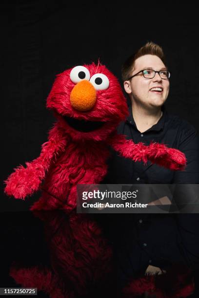 July 19: Elmo and Ryan Dillon of "Sesame Street" pose for a portrait in the Pizza Hut Lounge at 2019 Comic-Con International: San Diego on July 19,...