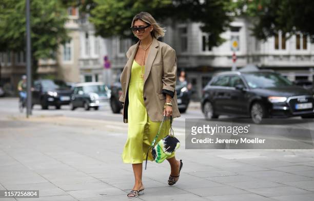 Aylin Koenig wearing The Frankie Shop blazer, Chanel shoes, Prada bag, Arket dress, Celine Sunglasses on June 20, 2019 in Hamburg, Germany.