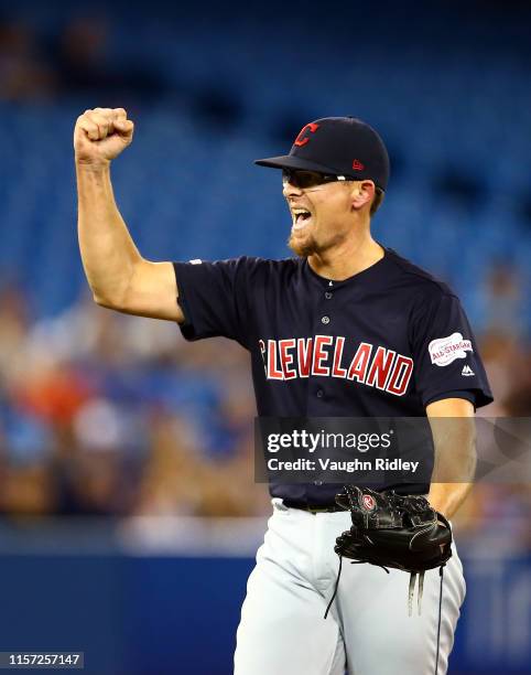 Tyler Clippard of the Cleveland Indians celebrates victory following the final out in the ninth inning during a MLB game against the Toronto Blue...