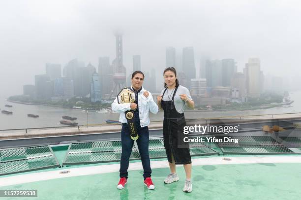 Fighter Jessica Andrade and UFC fighter Zhang Weili pose for photo during UFC Iconic photo session at The Peninsula Shanghai on June 21, 2019 in...