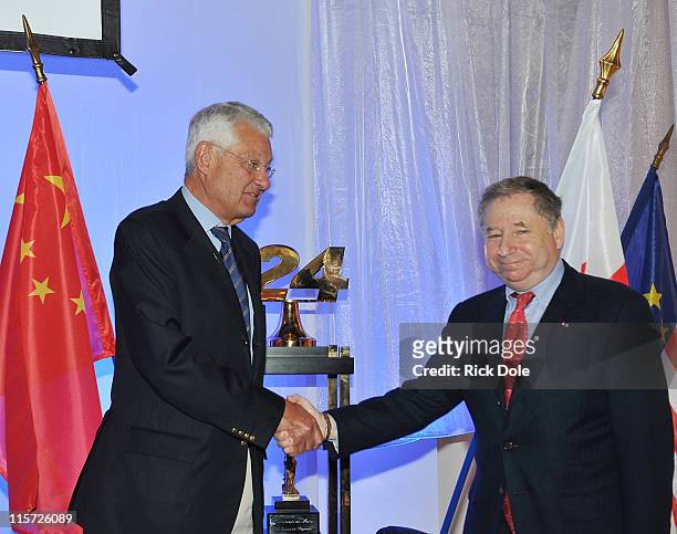 Jean-Claude Plassart, President, l'Automobile de l'Quest , and Jean Todt, President of the Federtion Internationale de l'Automobile shake hands upon...