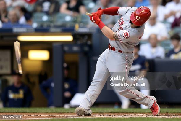 Tucker Barnhart of the Cincinnati Reds breaks his bat hitting a foul ball in the first inning against the Milwaukee Brewers at Miller Park on June...