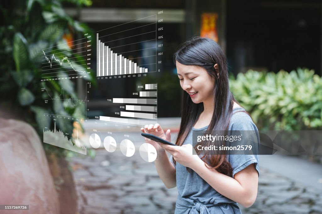 Young Businesswoman with financial technology concept