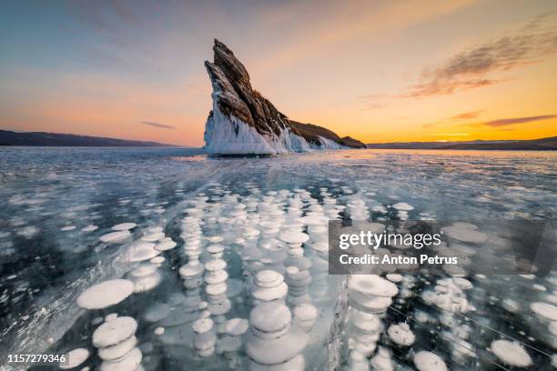 ogoy island at baikal in winter. bubbles in ice - baikal fotografías e imágenes de stock