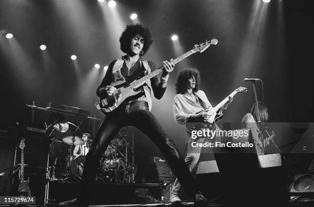 Phil Lynott , bassist and singer with rock band Thin Lizzy, playing the bass guitar on stage during a live concert performance at Wembley Empire...