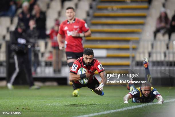 Richie Mo'unga of the Crusaders dives over to score a try during the Super Rugby Quarter Final match between the Crusaders and the Highlanders at...