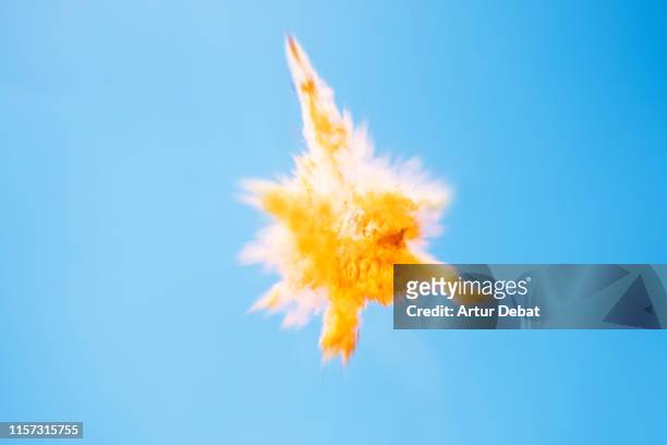 beautiful yellow powder explosion in the sky. - energy drink stock pictures, royalty-free photos & images